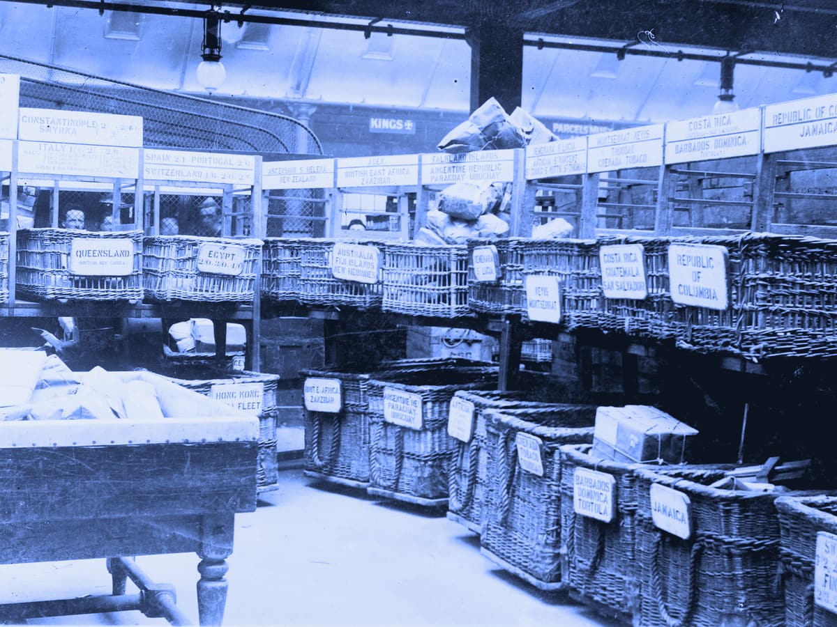 Wicker baskets labeled by country for sorting foreign parcels at the British Parcels Post
