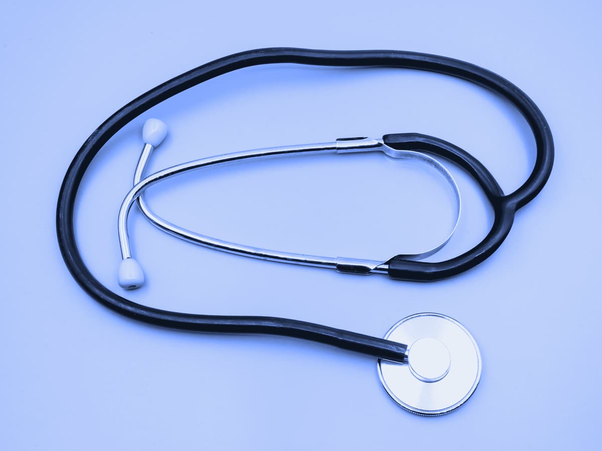 A stethoscope on a gray table