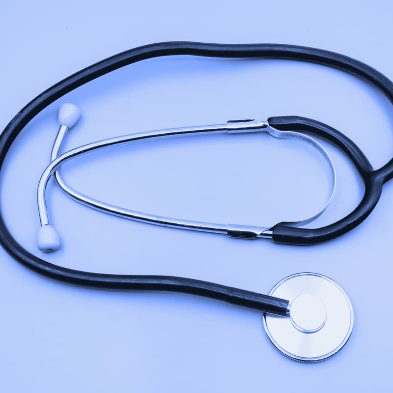 A stethoscope on a gray table